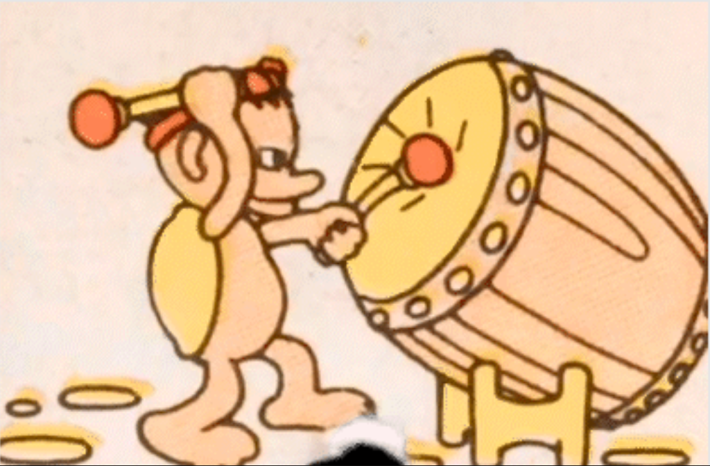 sample of japanese paper film frame featuring a cartoonish character beating a taiko drum