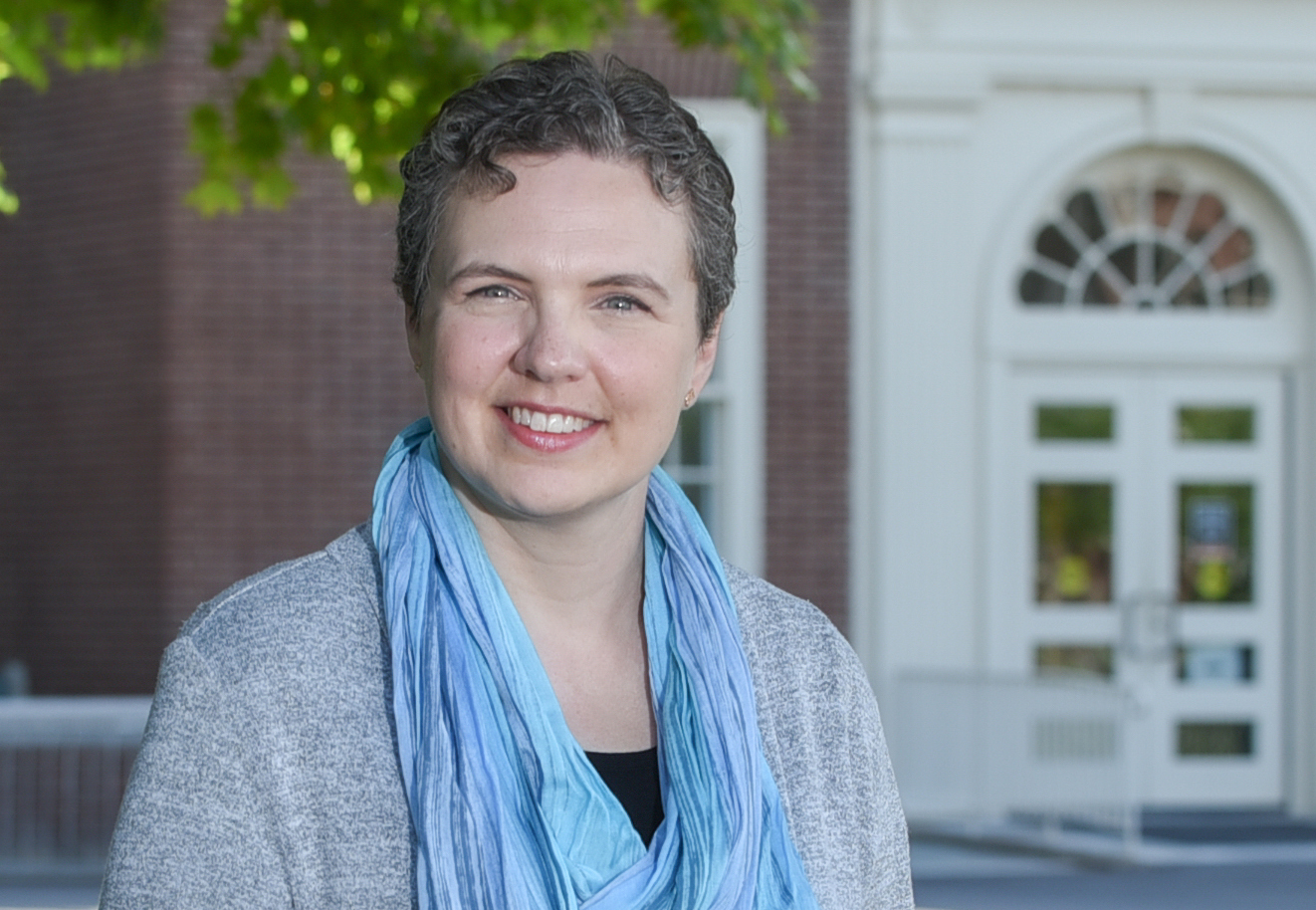 Mary Broussard in front of Bertrand Library's front door.